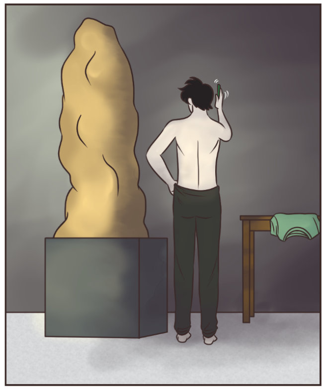 A full color comic panel. An art studio with some shadows. A large tower of clay stands on a modeling block. Tab, a grown man with black hair, stands with his back to the viewer; he's pulling up dark sweatpants with his left hand and holding his phone in his right hand. A green shirt hangs off the edge of a desk against a wall.