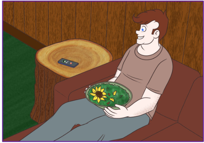 A full color comic panel. A slight downward view of Cillian Foy as he sits on a rust red-colored couch. He wears a dusty red t-shirt and grey sweatpants. He holds a green bowl filled with greens, which includes some acorns and a sunflower head. To his right is a tree stump. It has been cut so it serves as an end table. Cillian's phone sits on top and he is speaking toward it.