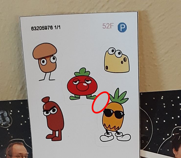 The mushroom, cheese, tomato, sausage, and pineapple Toppins on a sticker page. A red circle indicates where the tomato and pineapple stickers are connected.