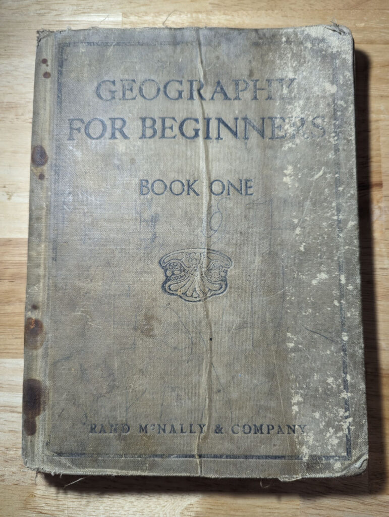 Geography for Beginners - Book One, published by Rand McNally & Company. An old, worn book from the 1920s.