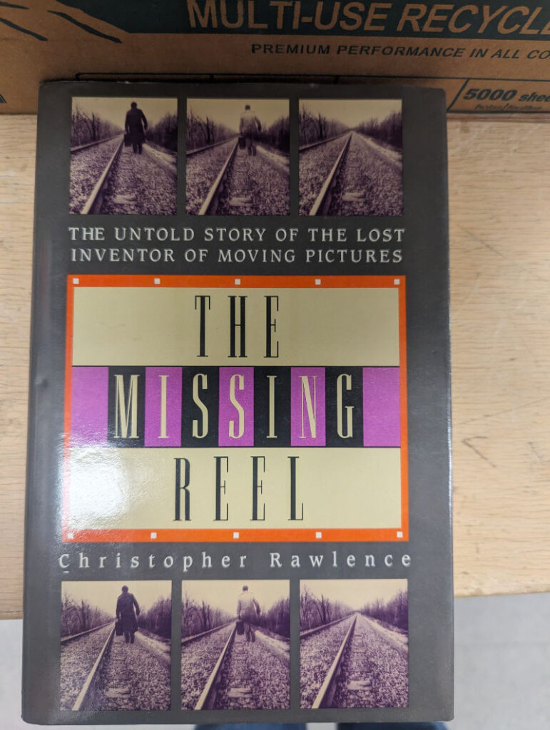 The cover of The Missing Reel: The Untold Story of the Lost Inventor of Moving Pictures by Christopher Rawlence.