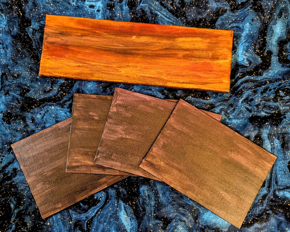 Small art canvases painted to look like wood.